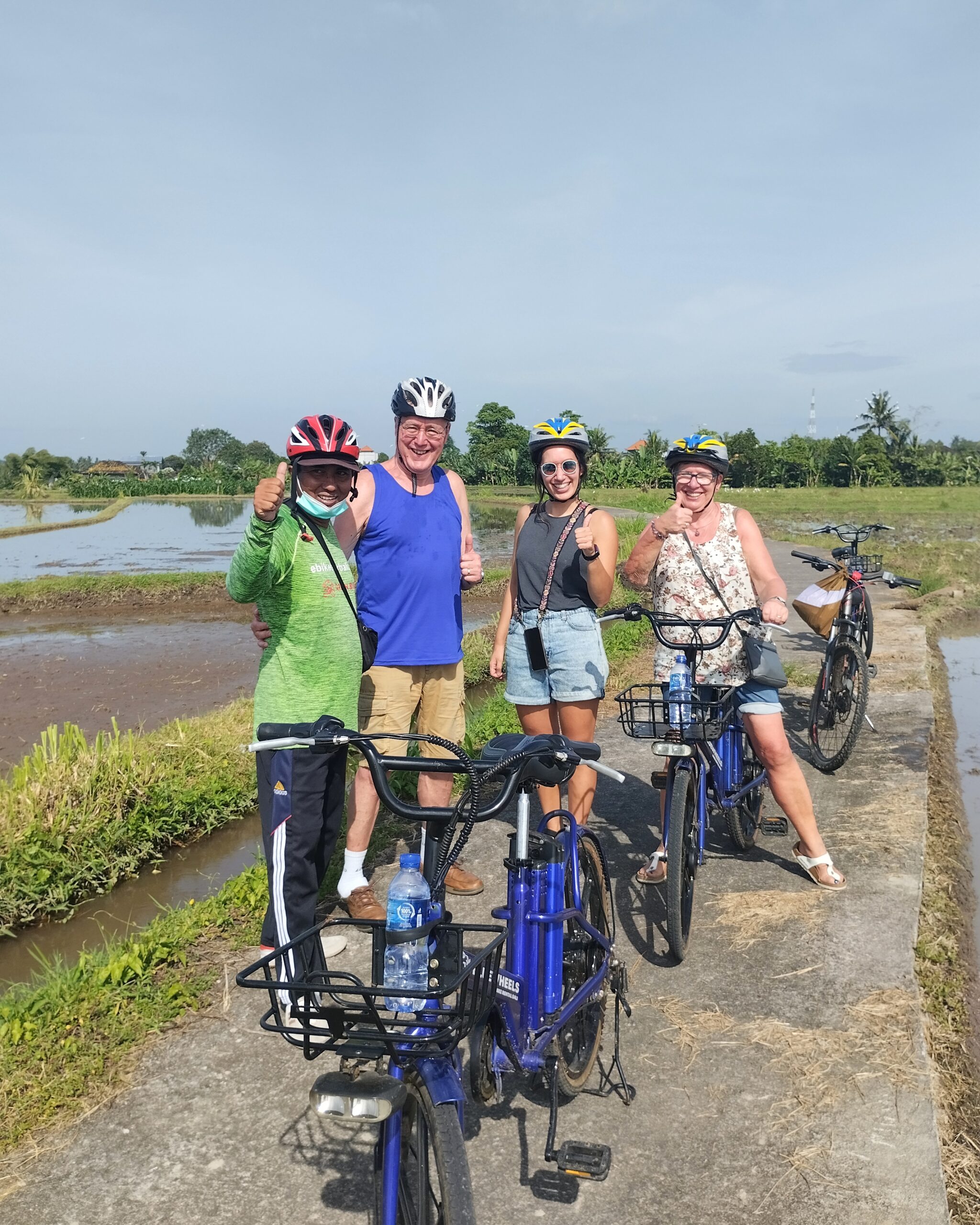 Clients on ebike tour in the rice fields nearby Ubud